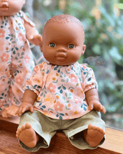 Baby doll with a floral shirt and green pants